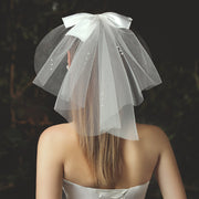 Short double-layer beige bridal veil with delicate pearl-style details