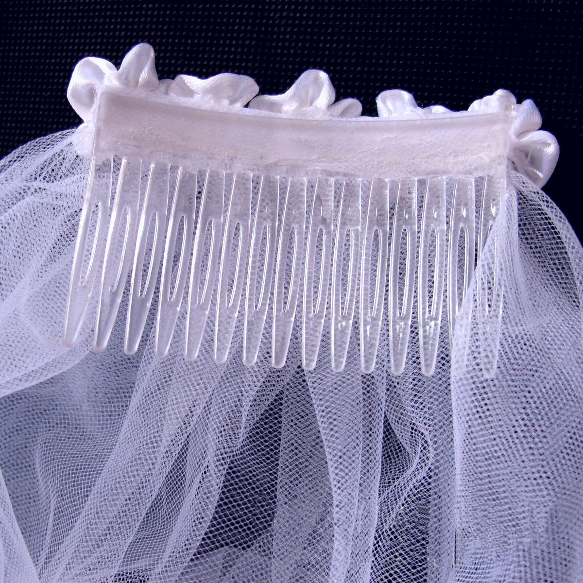 Romantic layered wedding veil with delicate floral lace trim