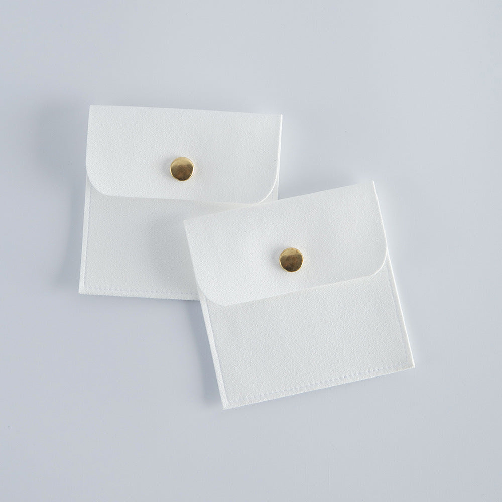 Soft velvet wedding party gift pouch with polished gold-tone closure