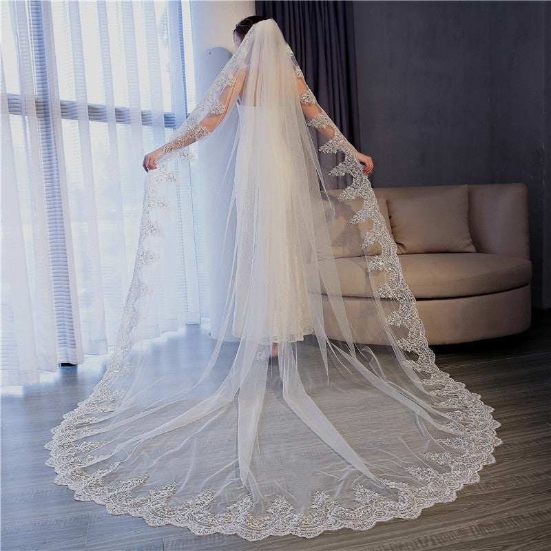 Back view of Celestine cathedral veil showing its sweeping floral lace border