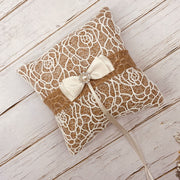 Wedding ring bearer pillow with ribbon bow and pearl-inspired accent