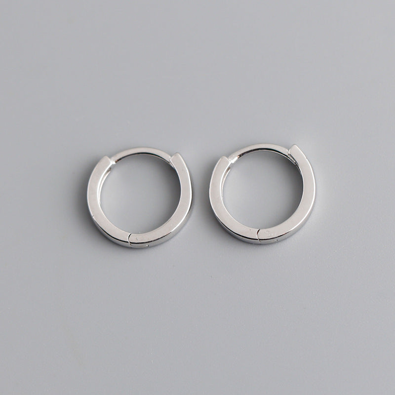 Minimal round huggie earrings with hinged closure