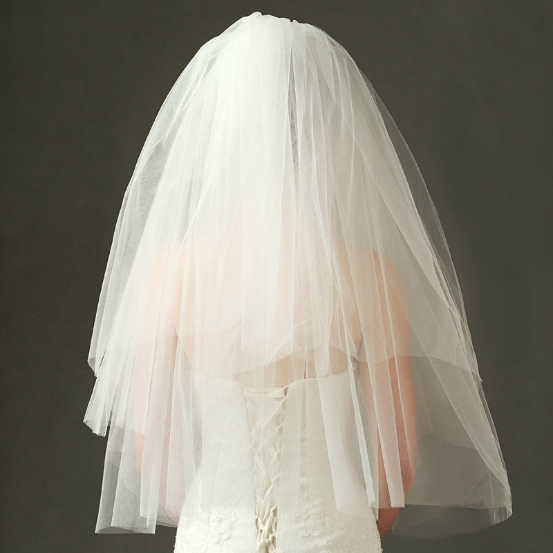 Juliette classic bridal veil displayed from the back with a softly voluminous layered silhouette