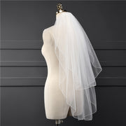 Side view of the Elise short bridal veil showing its soft layered drape and lightweight mesh