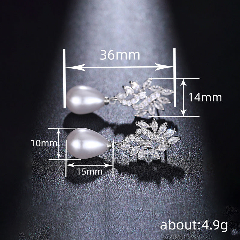 Elodie silver tone leaf earrings with pearl style drops