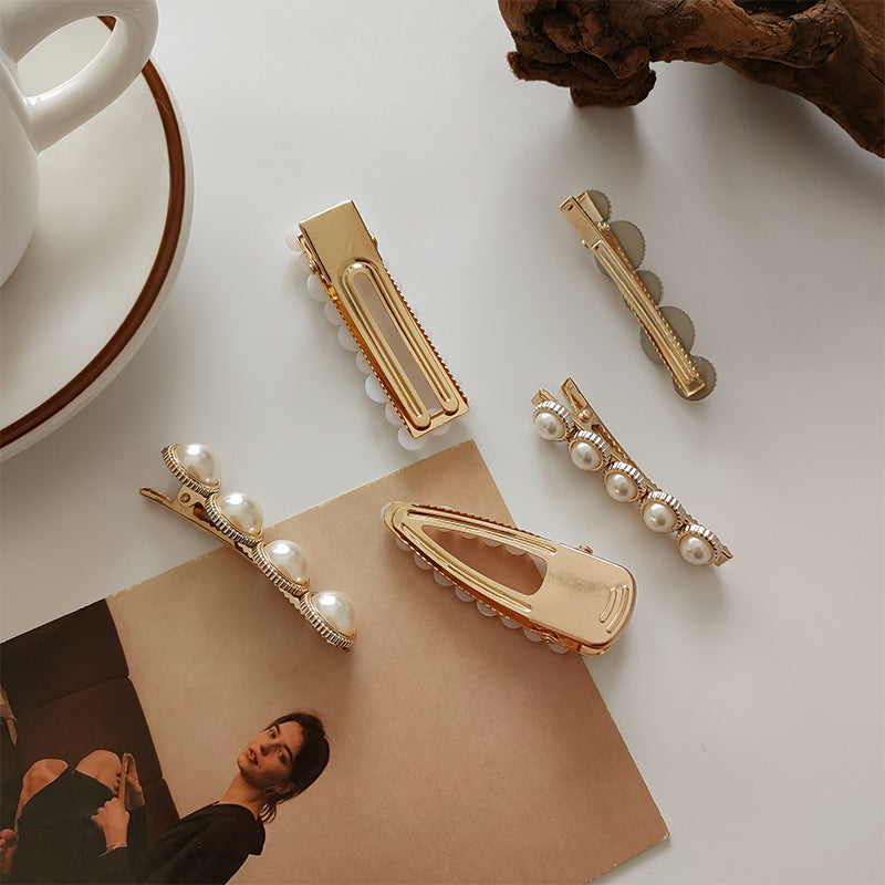 Gold tone white pearl side hair accessory