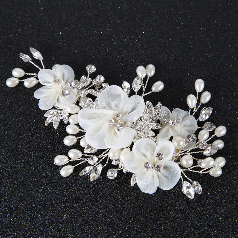Rosalie botanical wedding hair accessory with delicate white blossoms
