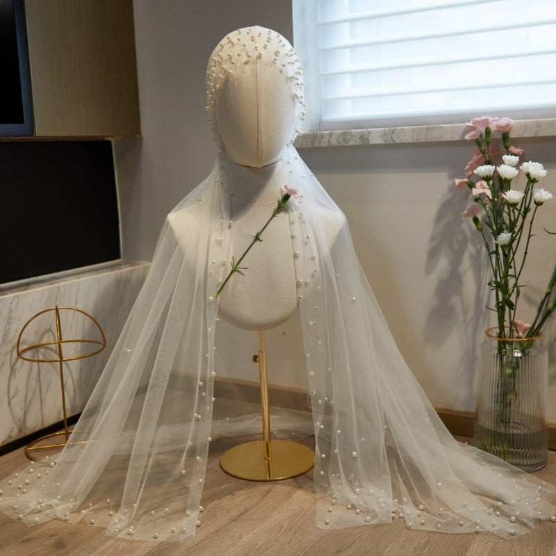 Long white pearl accent bridal veil for wedding ceremony
