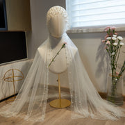 Long white pearl accent bridal veil for wedding ceremony