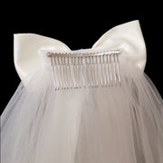 Back view of the Colette bridal bow veil showing the gathered mesh and attachment area beneath the bow