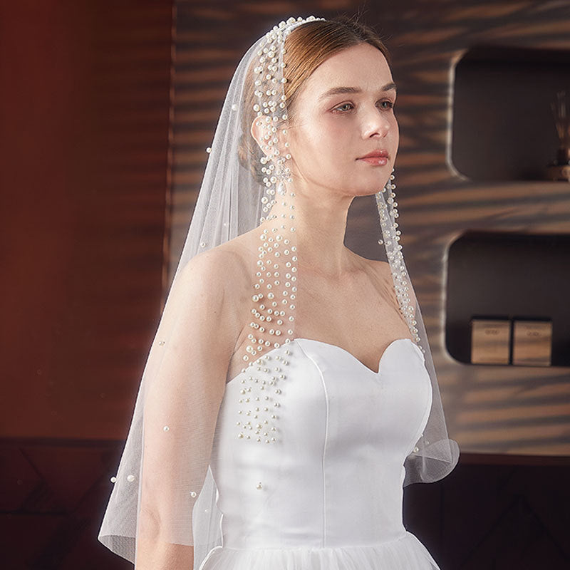 White pearl trimmed mid length wedding veil