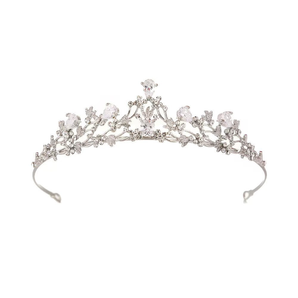 Adeline silver-tone floral bridal tiara with delicate leaf motifs and sparkling rhinestone accents on a white background