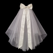 Colette short bridal veil with layered sheer mesh and long satin-style bow ribbons against a black background