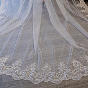 Close-up of floral lace edging and sheer mesh on the Celestine bridal veil