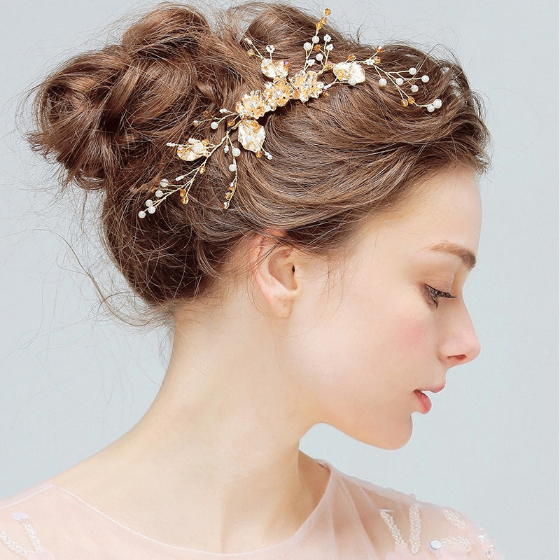 Crystal Blossom bridal hair comb with gold-tone floral branches and pearl-style accents