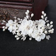 Pearl Blossom bridal hairpiece featuring crystal-style floral detailing