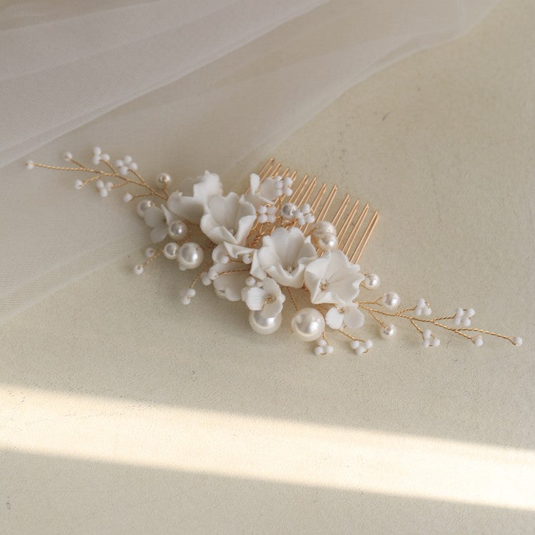 Ivory Blossom wedding hair comb with white floral and pearl-style details