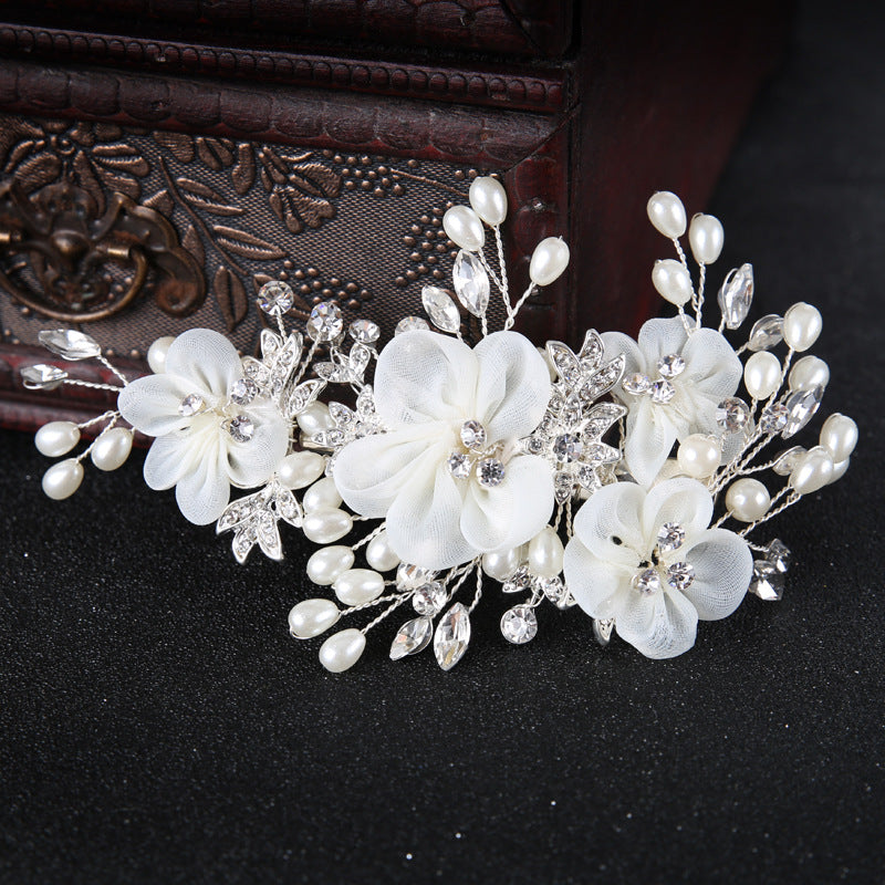 White floral hair accessory for romantic bridal hairstyles