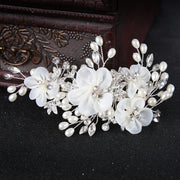 White floral hair accessory for romantic bridal hairstyles
