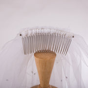Short white wedding veil with rhinestone details