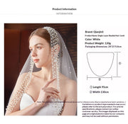 White mid length bridal veil with pearls