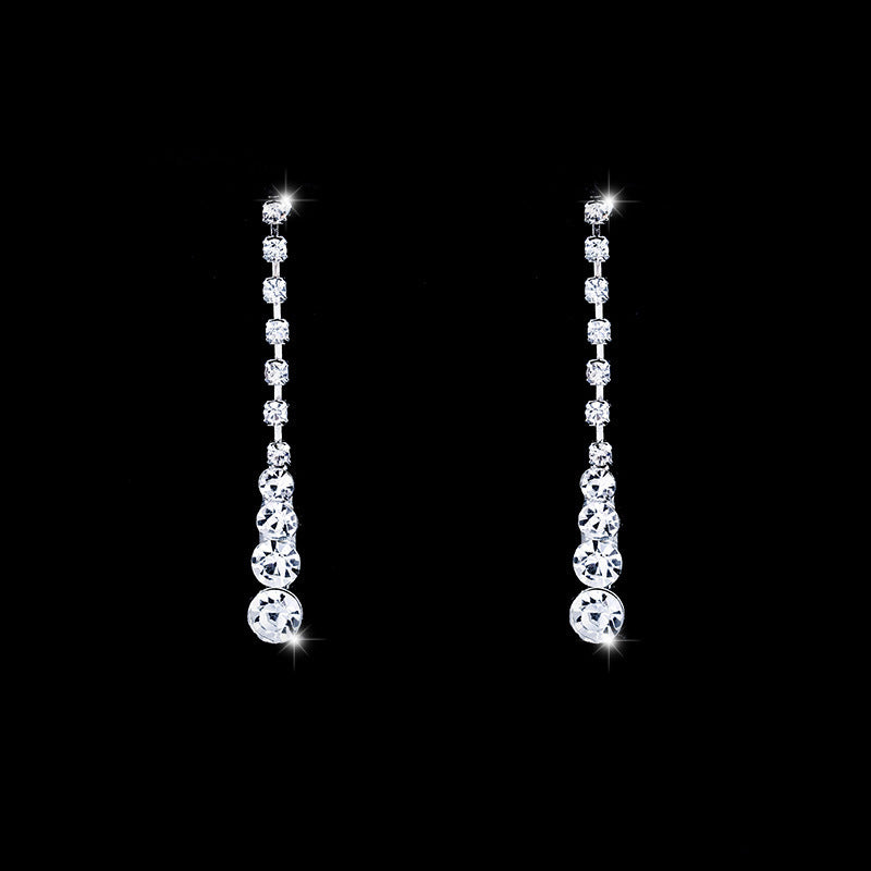 Pair of Seraphina long silver-tone drop earrings with sparkling crystal-style details