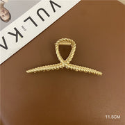 Margot polished gold hair claw accessory