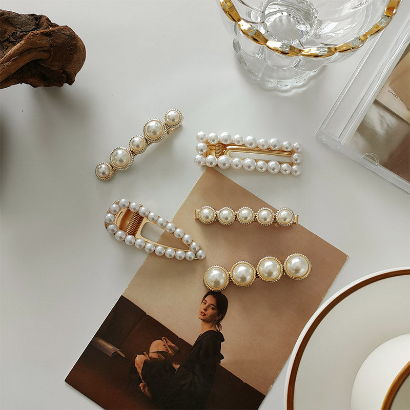 White faux pearl hair clip with gold tone accents
