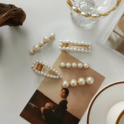 White faux pearl hair clip with gold tone accents
