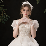 Bridal portrait highlighting pearl details on gloves