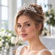 Bride wearing the Adeline rhinestone floral wedding tiara with a romantic bridal hairstyle