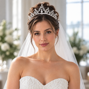 Bride wearing the Vivienne Crystal Classic bridal tiara with sparkling teardrop-shaped crystal-style accents and an elegant white veil