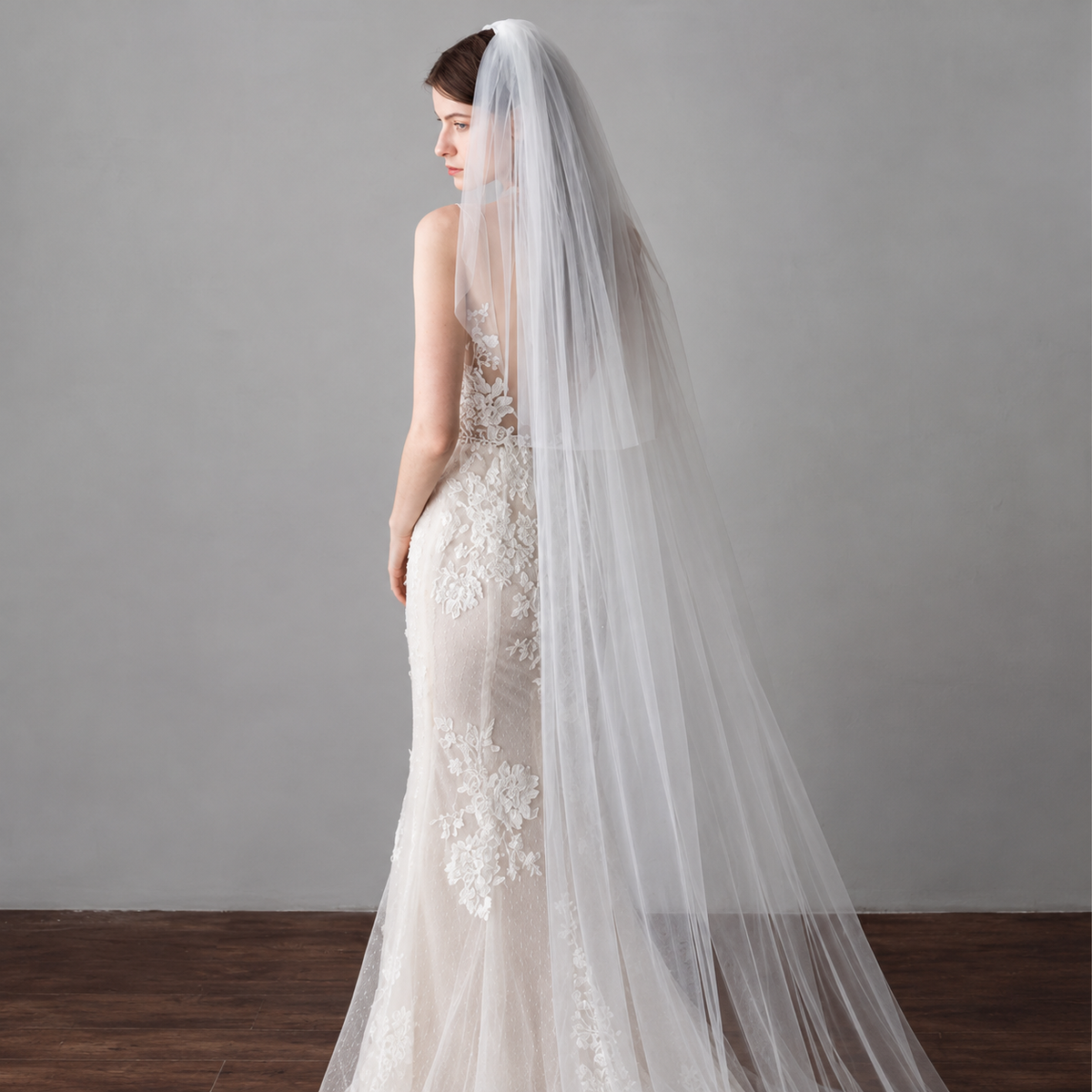 Elegant bridal portrait featuring the Amélie minimalist two-tier cathedral veil