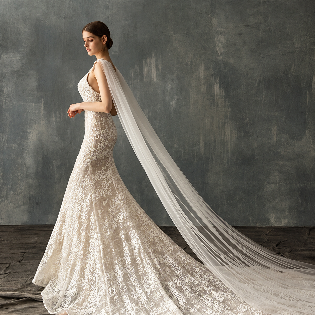 Elegant ivory lace bridal portrait featuring the Seraphina crystal cathedral veil