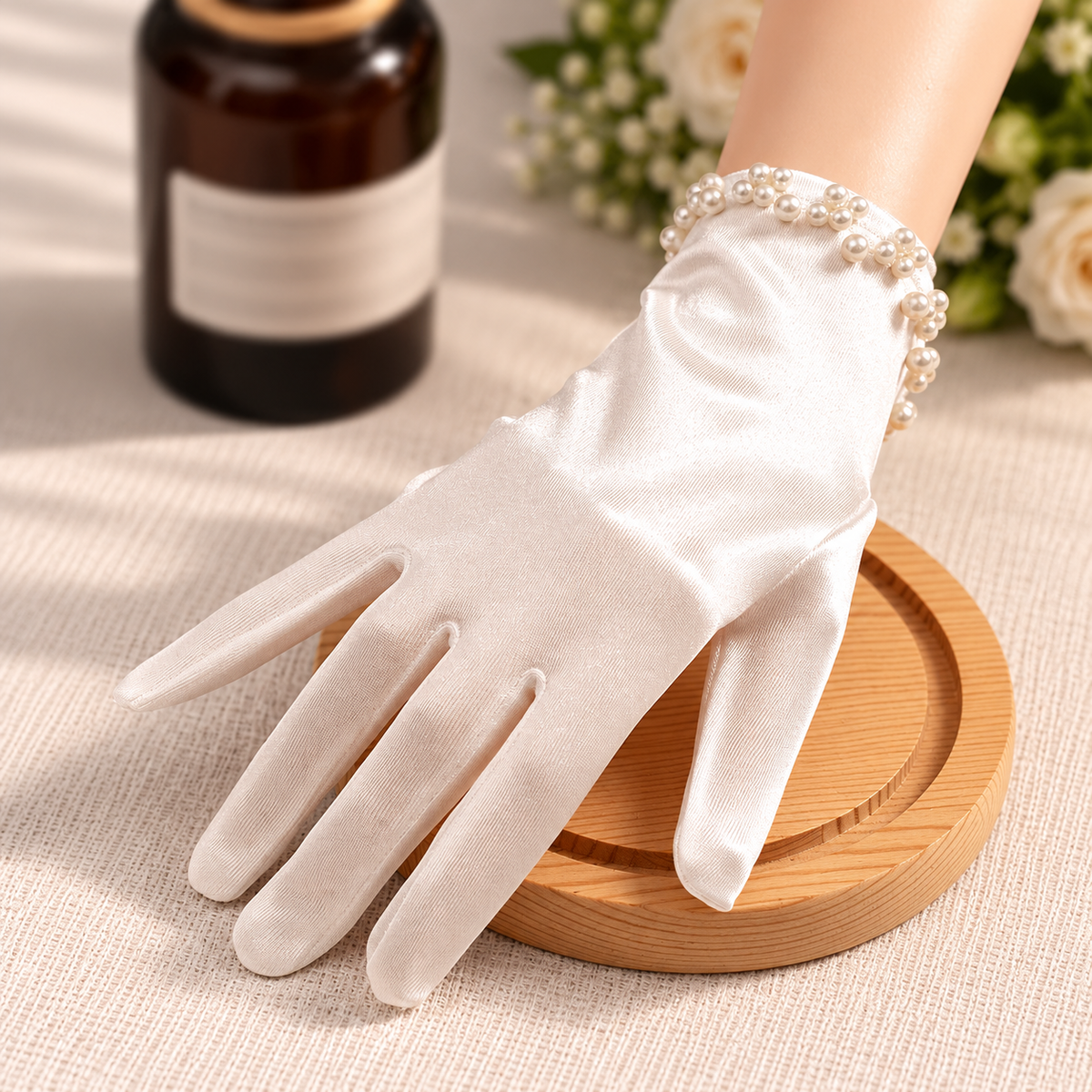 White bridal glove styled with pearl accents