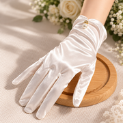 White satin bridal glove with delicate pearl-inspired wrist accent