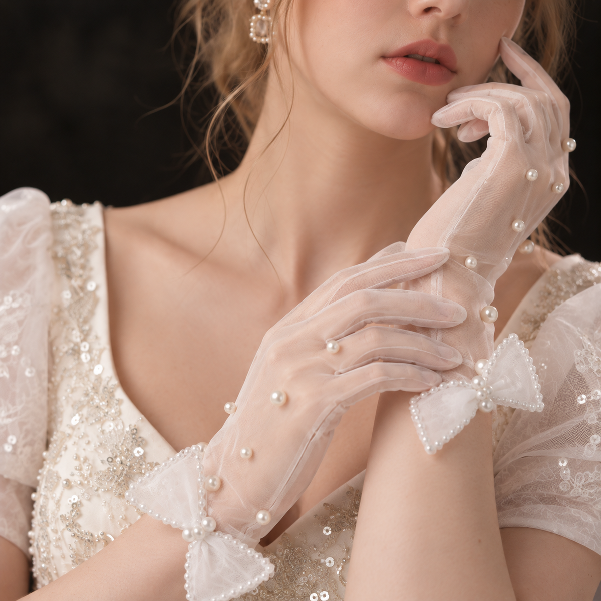 Bridal portrait featuring pearl embellished gloves