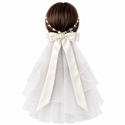 Colette oversized bow bridal veil with soft layered mesh and long ribbon tails shown from behind