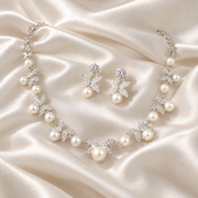 Pearl and Diamond Floral Jewelry on Satin — The Fleur Pearl Blossom Bridal Jewelry Set