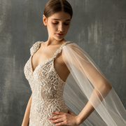 Serene bride in ivory lace wearing the Seraphina crystal cathedral veil