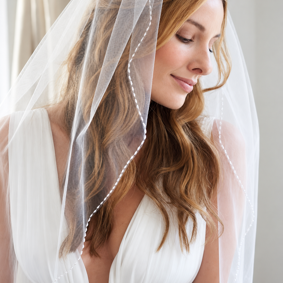 Serene veiled bridal portrait — Colette Crystal-Edge Fingertip Bridal Veil
