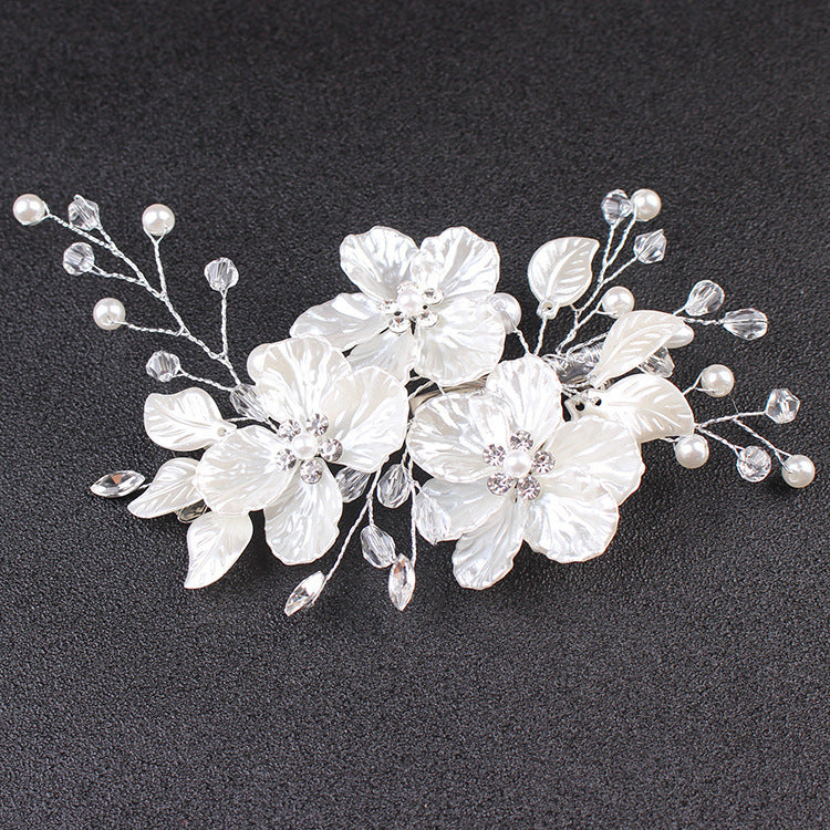 Floral wedding hairpiece in a delicate botanical silhouette