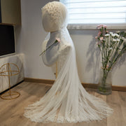 Flowing pearl embellished white wedding veil