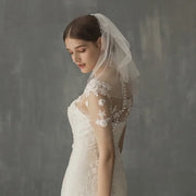 Céleste pearl-accented short bridal veil in a bridal styling video