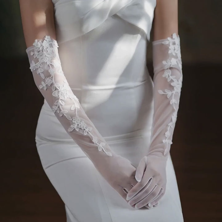 Florence ivory floral lace bridal gloves shown in a product video